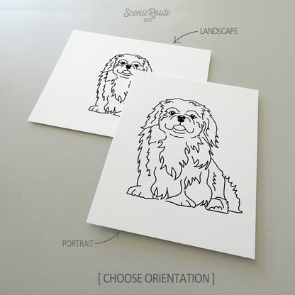 Two line art drawings of a Pekingese dog on white linen paper with a gray background.  The pieces are shown in portrait and landscape orientation for the available art print options.