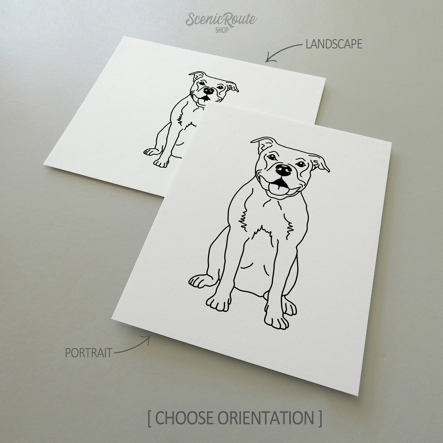 Two line art drawings of a Pitbull dog on white linen paper with a gray background.  The pieces are shown in portrait and landscape orientation for the available art print options.