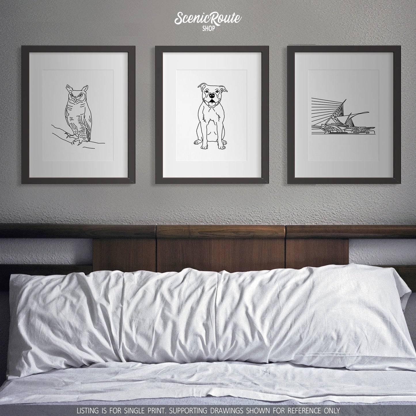 A group of three framed drawings on a gray wall above a bed. The line art drawings include an Owl, a Pitbull dog, and the Milwaukee Museum of Art