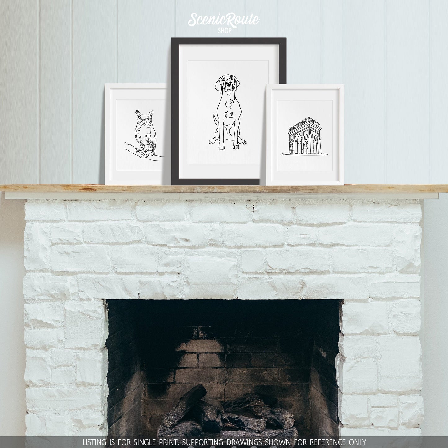 A group of three framed drawings on a fireplace mantle. The line art drawings include an Owl, a Pointer dog, and the Paris Arc de Triomphe