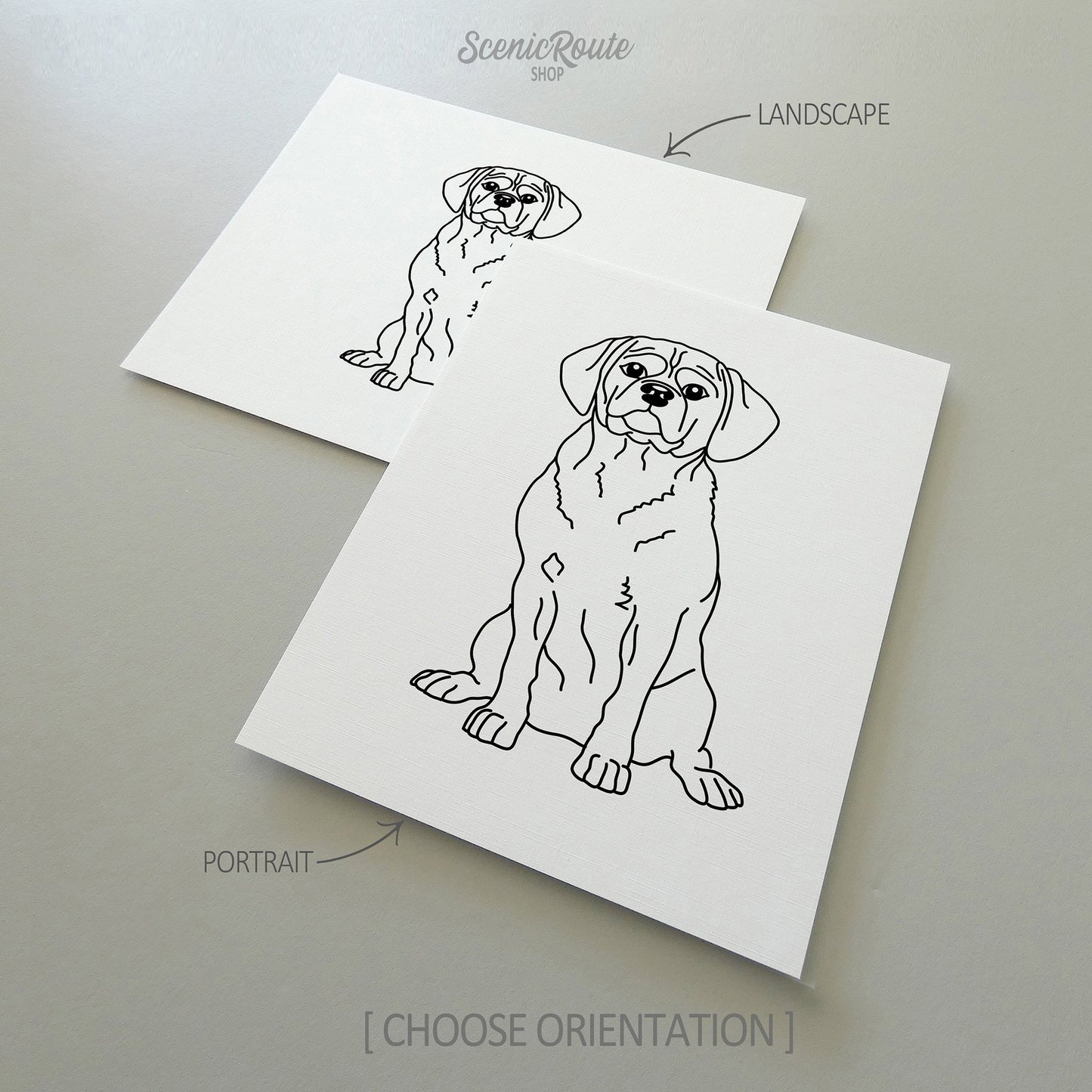 Two line art drawings of a Puggle dog on white linen paper with a gray background.  The pieces are shown in portrait and landscape orientation for the available art print options.