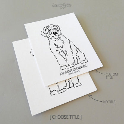 Two line art drawings of a Wheaten Terrier dog on white linen paper with a gray background.  The pieces are shown with “No Title” and “Custom Title” options for the available art print options.