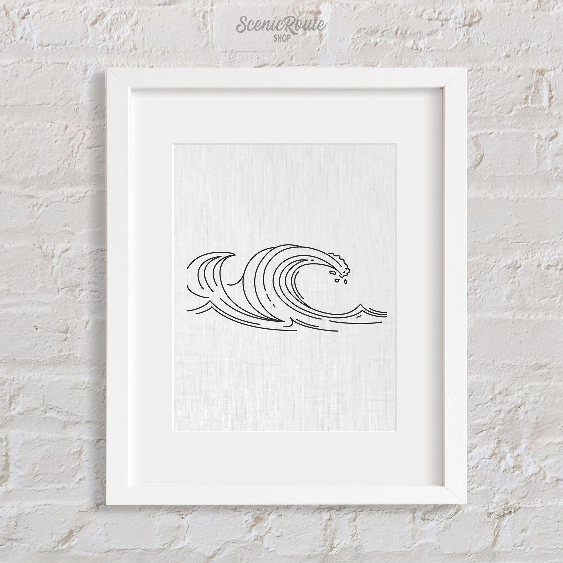 A framed line art drawing of Waves on a brick wall