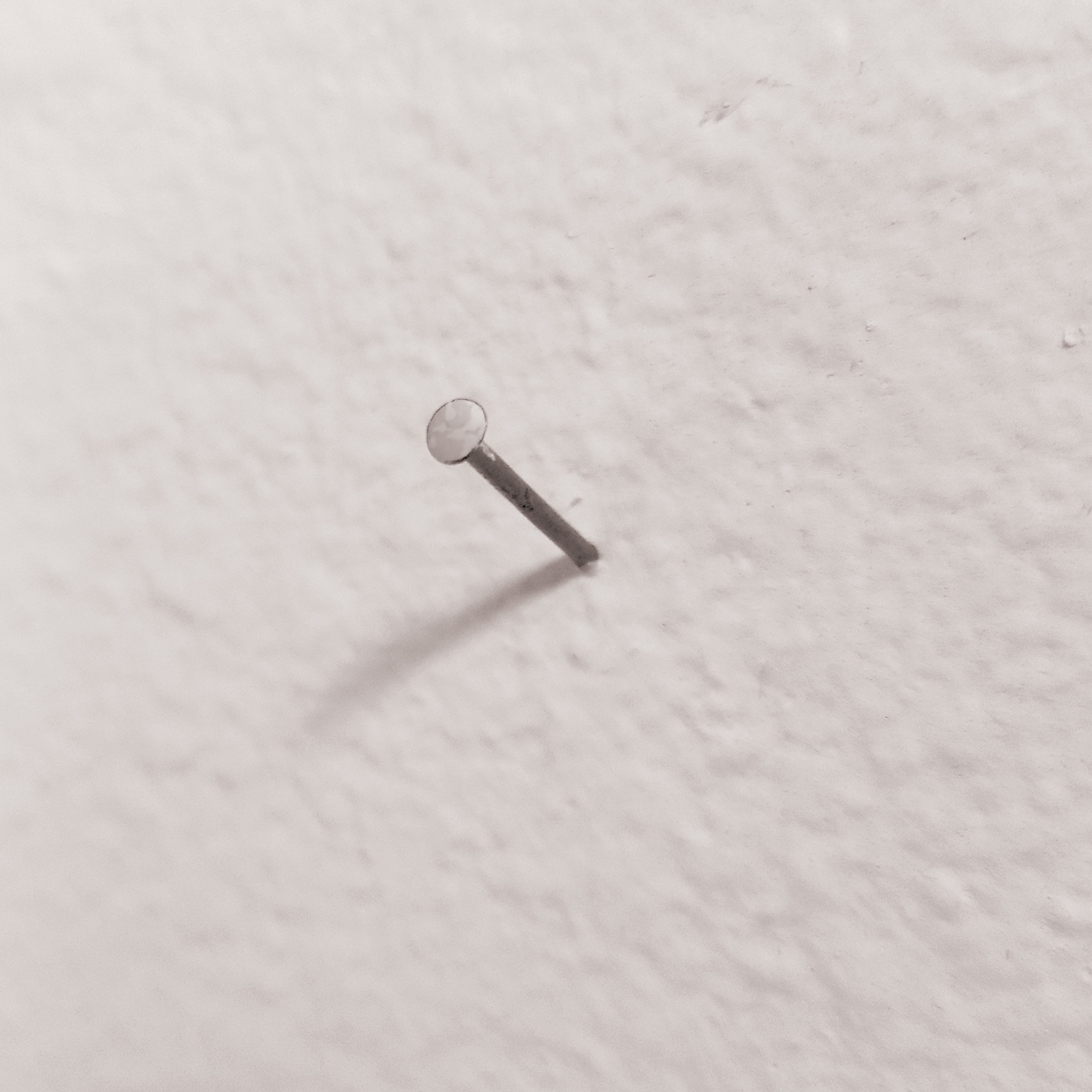 A small nail in a wall