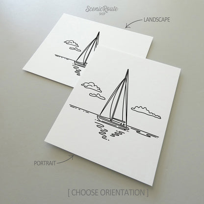 Two line art drawings of Sailing on white linen paper with a gray background.  The pieces are shown in portrait and landscape orientation for the available art print options.