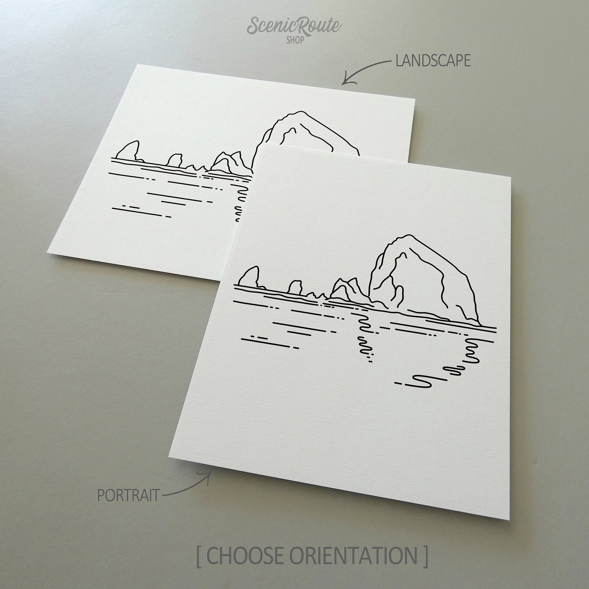 Two line art drawings of Haystack Rock on white linen paper with a gray background.  The pieces are shown in portrait and landscape orientation for the available art print options.