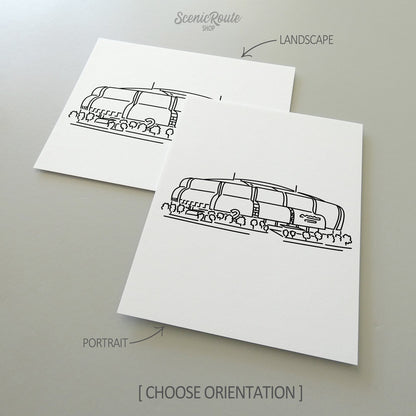 Two line art drawings of the Cardinals Stadium on white linen paper with a gray background.  The pieces are shown in portrait and landscape orientation for the available art print options.