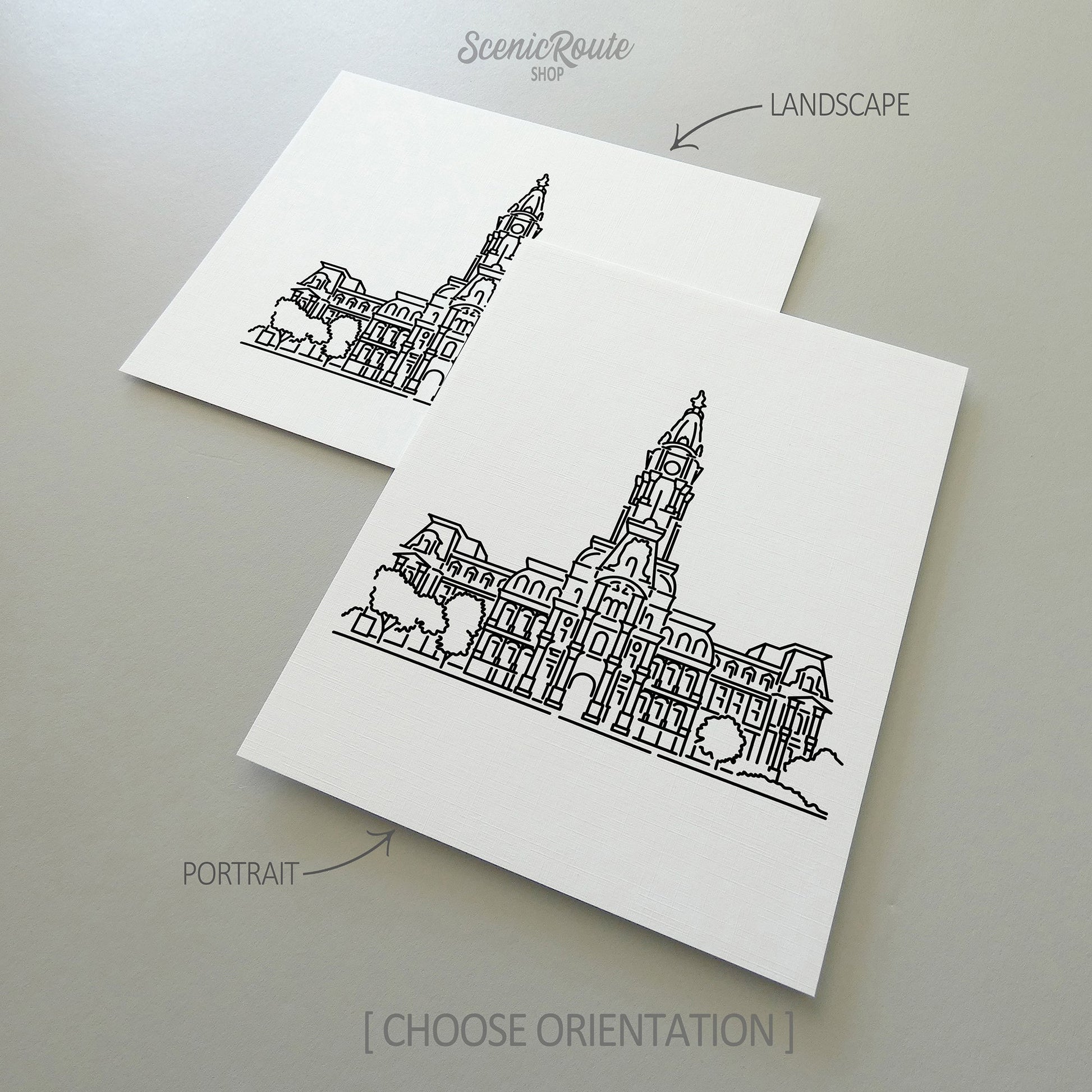Two line art drawings of Philadelphia City Hall on white linen paper with a gray background.  The pieces are shown in portrait and landscape orientation for the available art print options.