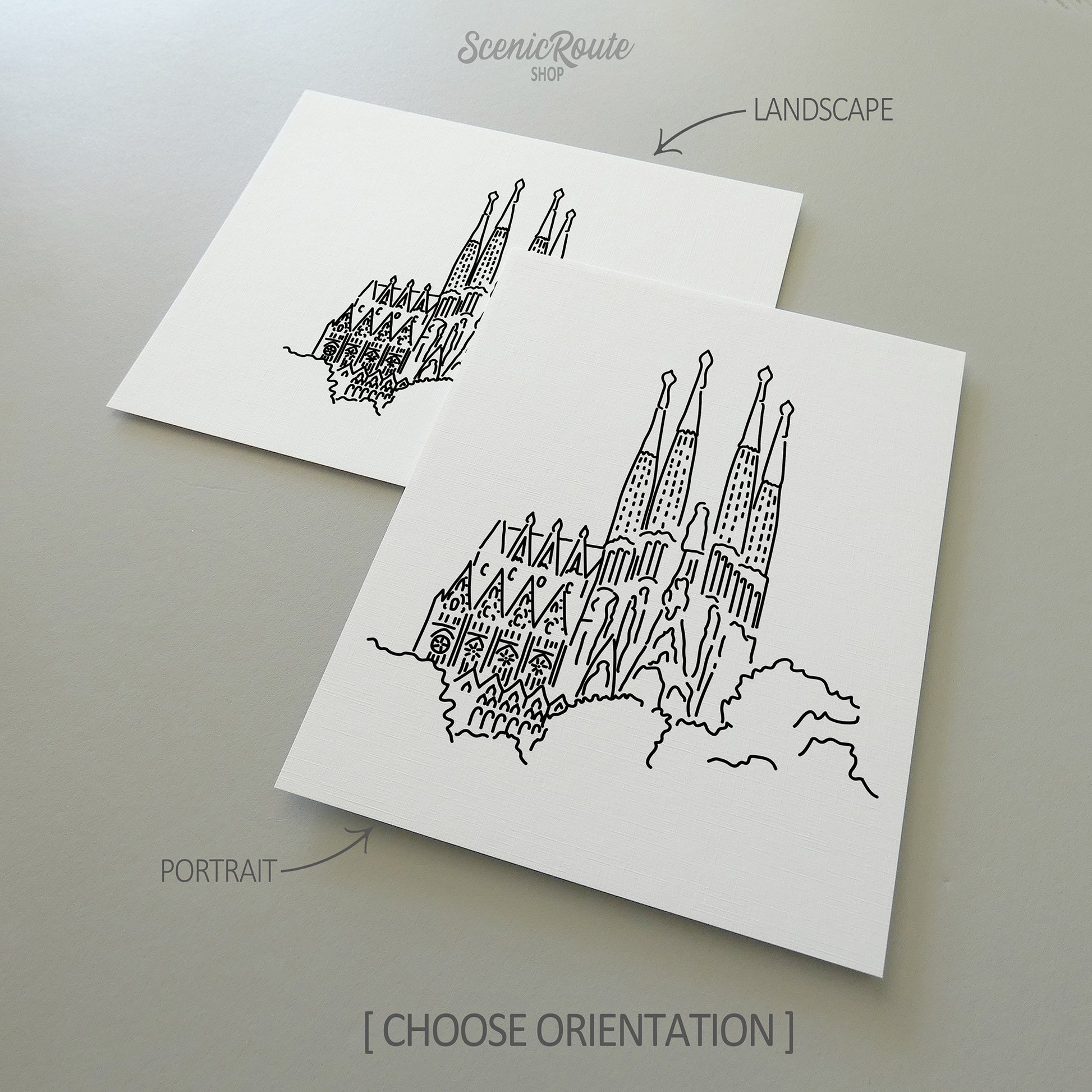 Two line art drawings of the Sagrada Familia on white linen paper with a gray background. The pieces are shown in portrait and landscape orientation for the available art print options.