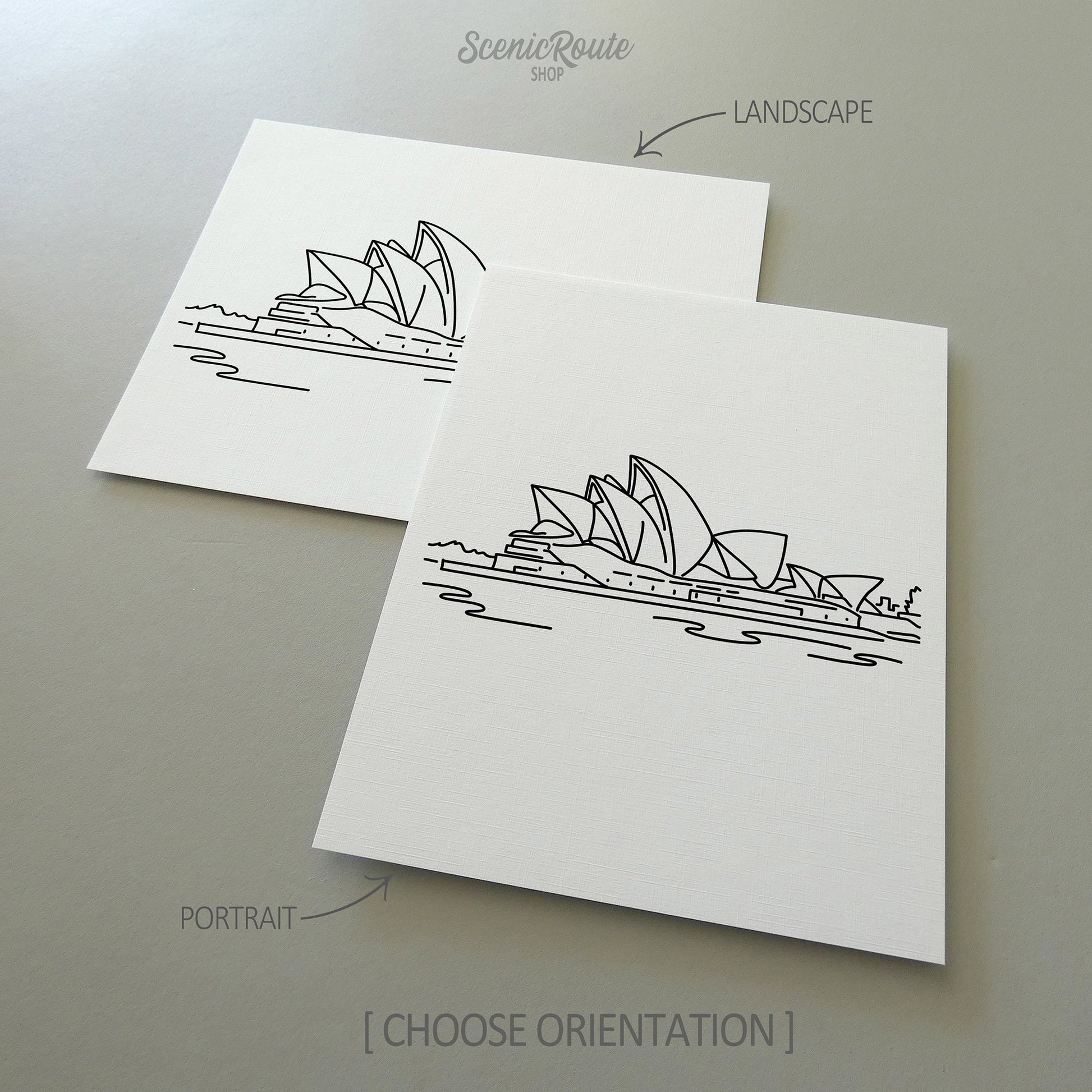 Two line art drawings of the Sydney Opera House on white linen paper with a gray background.  The pieces are shown in portrait and landscape orientation for the available art print options.