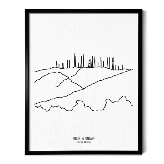 A line art drawing of South Mountain in Phoenix Arizona on white linen paper in a thin black picture frame