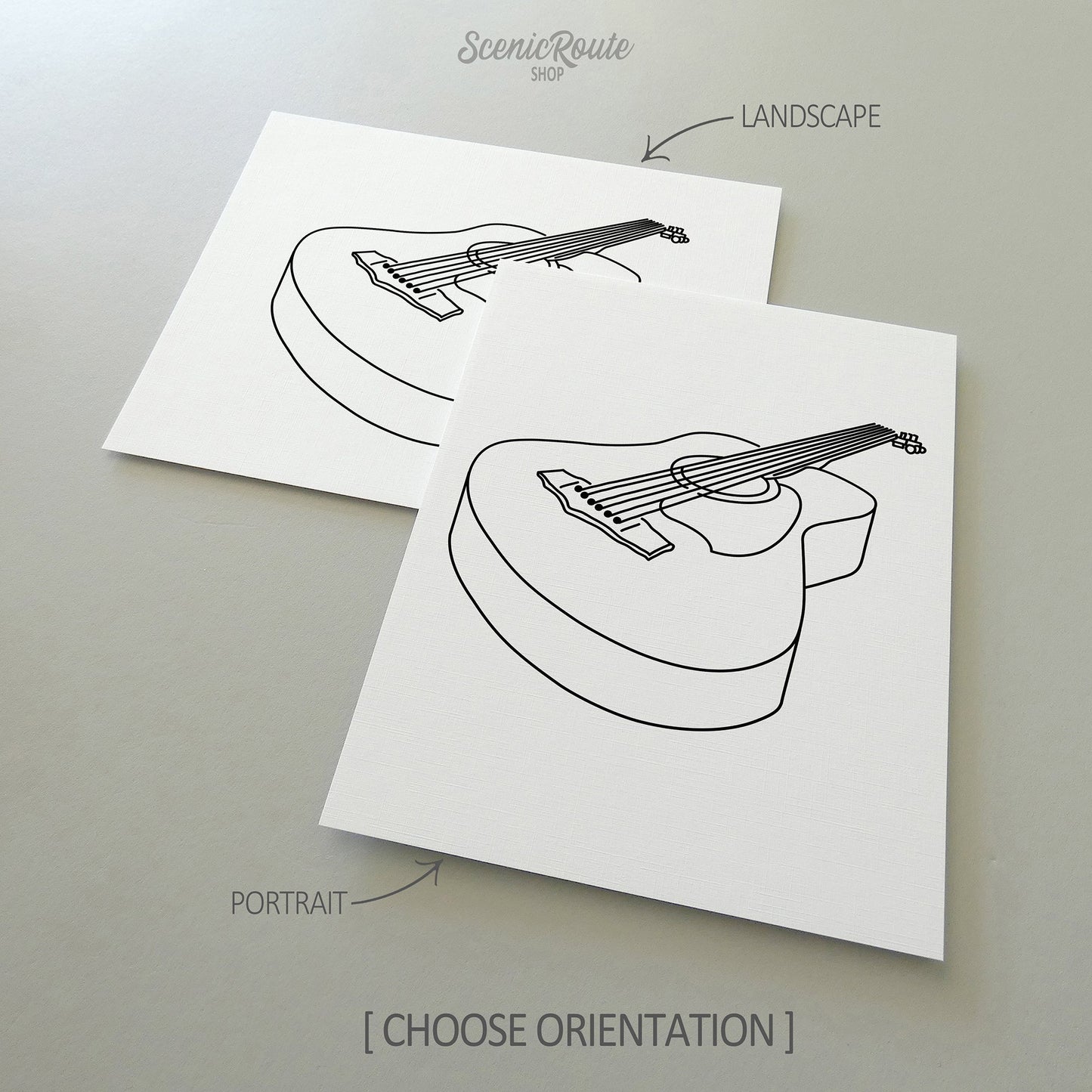 Two line art drawings of a Guitar on white linen paper with a gray background.  The pieces are shown in portrait and landscape orientation for the available art print options.
