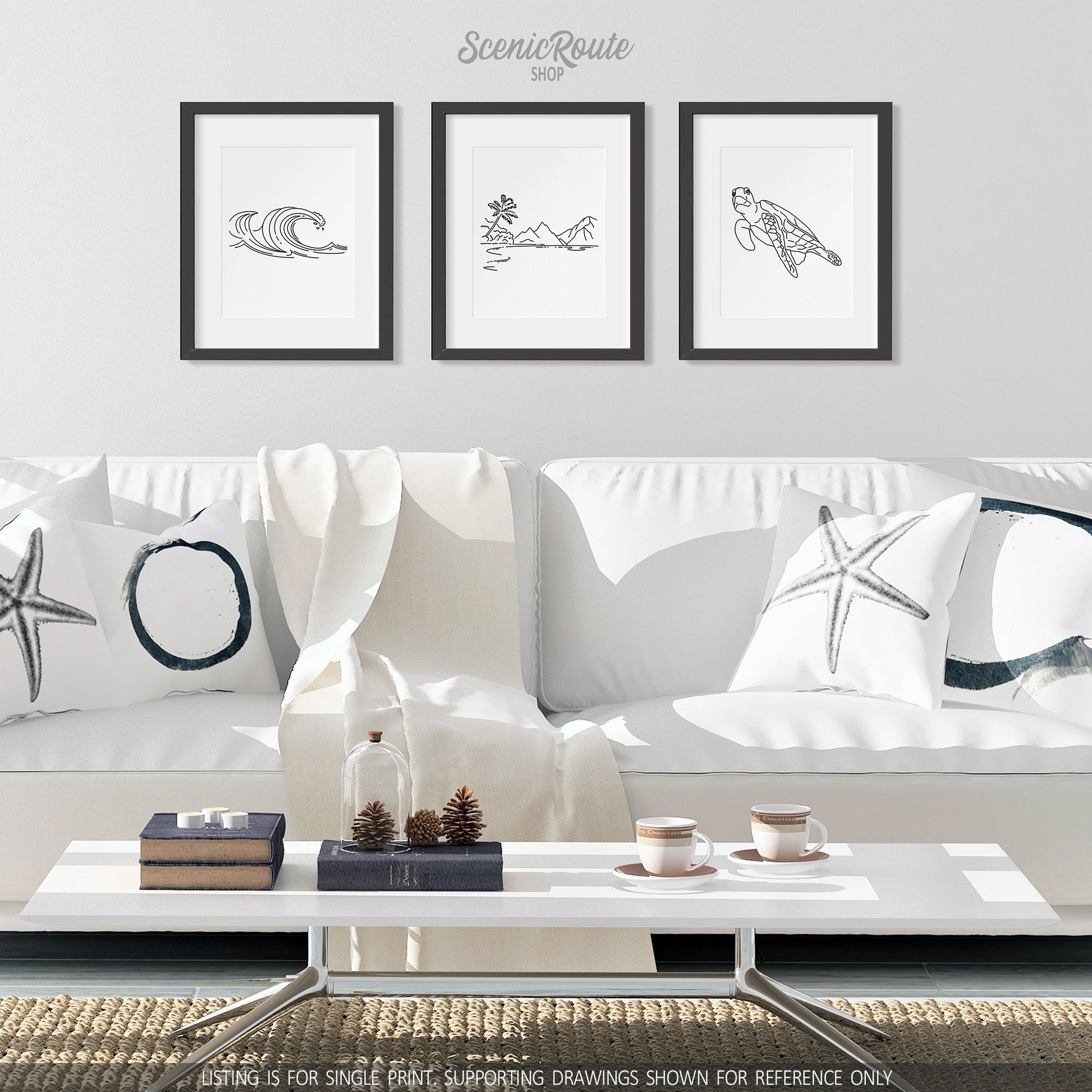 A group of three framed drawings on a wall above a couch. The line art drawings include Waves, American Samoa National Park, and a Sea Turtle