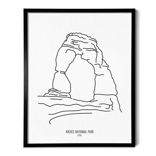A line art drawing of Arches National Park on white linen paper in a thin black picture frame