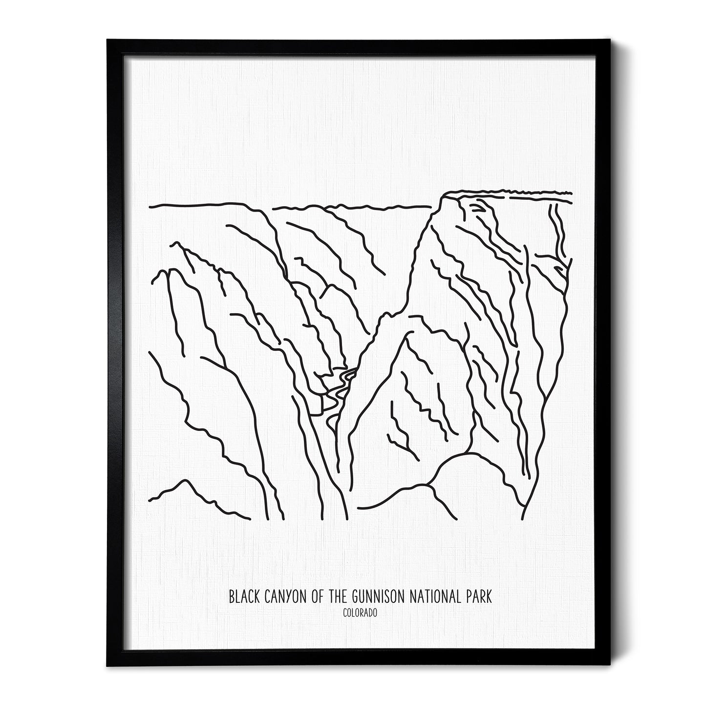 A line art drawing of Black Canyon of the Gunnison National Park on white linen paper in a thin black picture frame