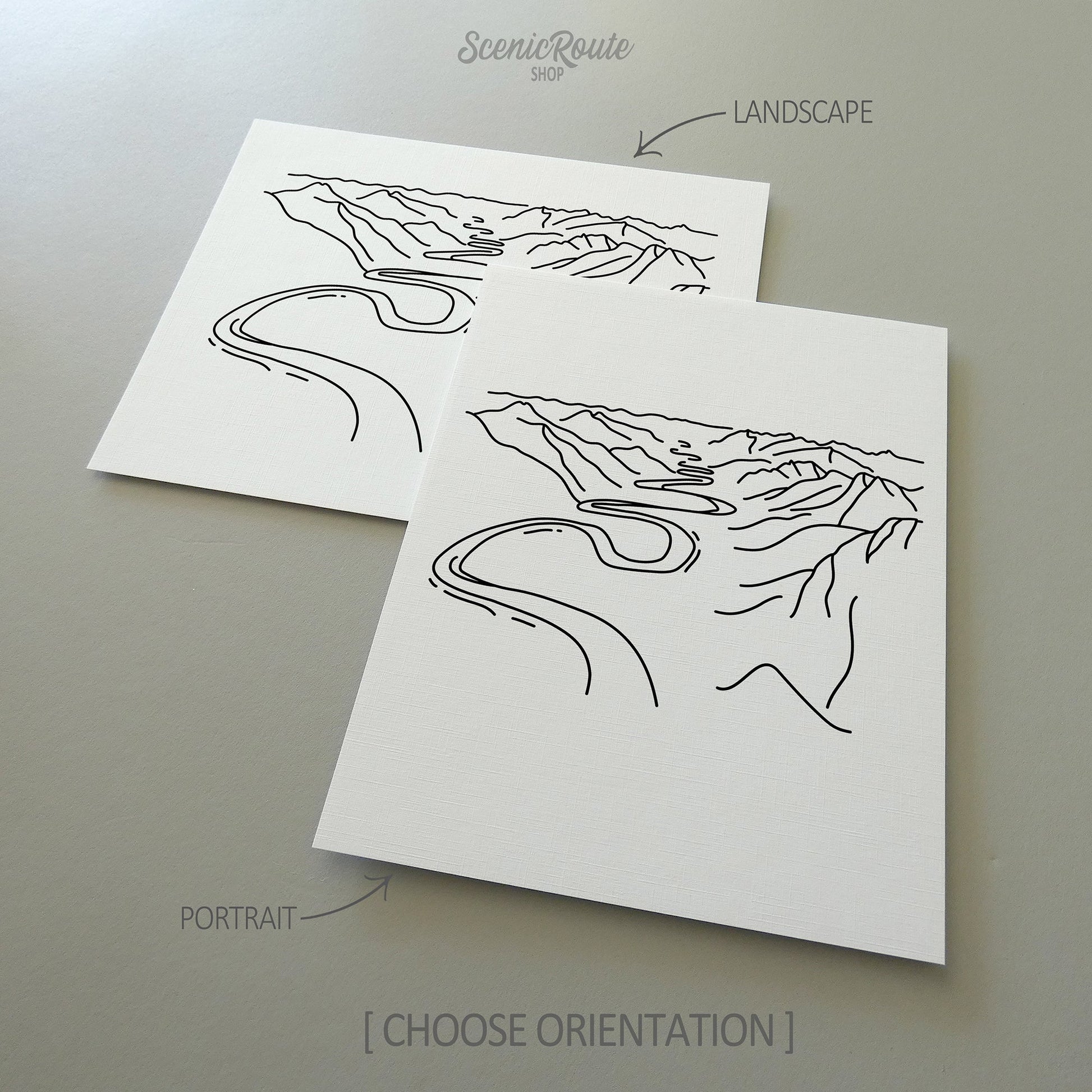 Two line art drawings of Gates of the Arctic National Park on white linen paper with a gray background.  The pieces are shown in portrait and landscape orientation for the available art print options.