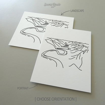 Two line art drawings of Gates of the Arctic National Park on white linen paper with a gray background.  The pieces are shown in portrait and landscape orientation for the available art print options.