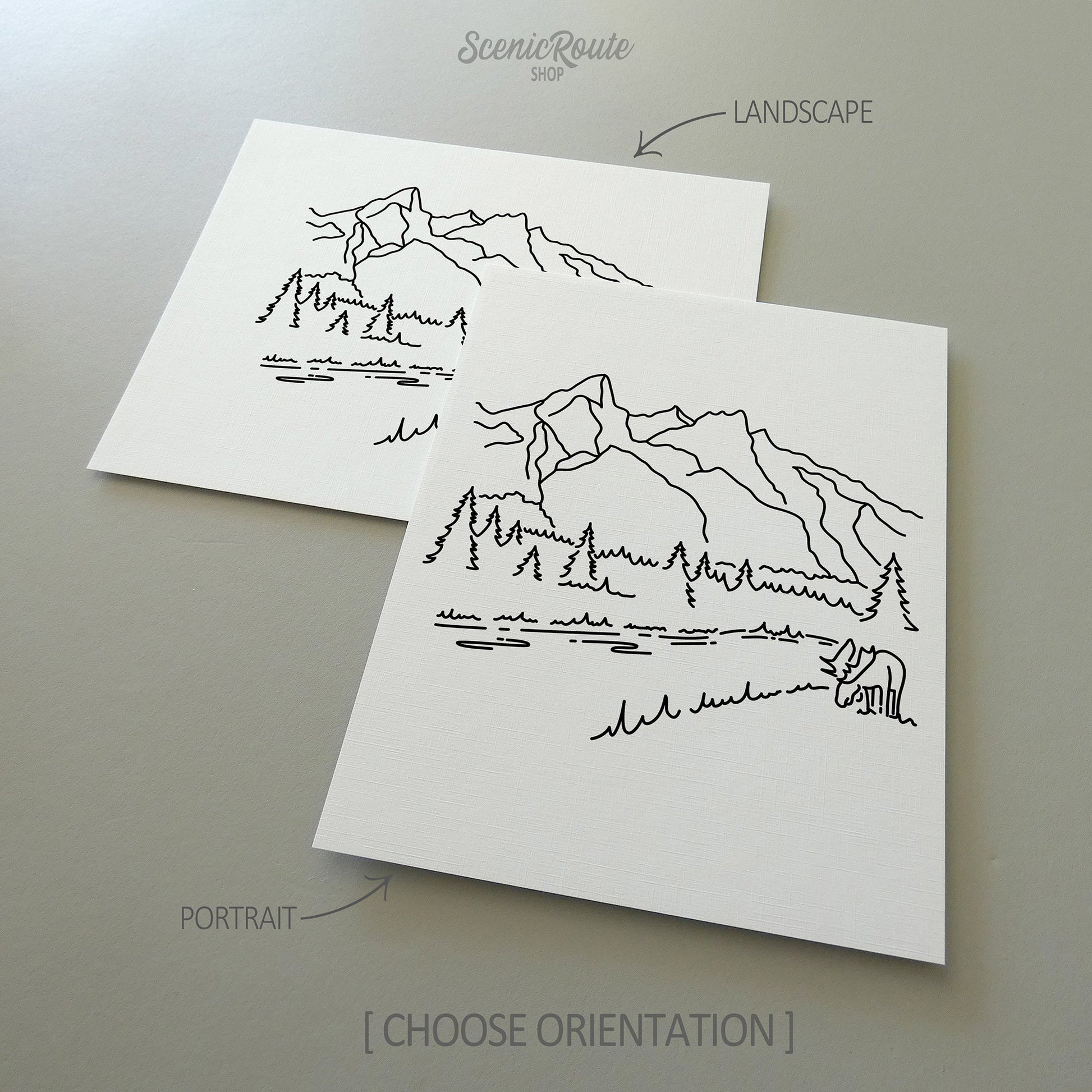 Two line art drawings of Grand Teton National Park on white linen paper with a gray background.  The pieces are shown in portrait and landscape orientation for the available art print options.