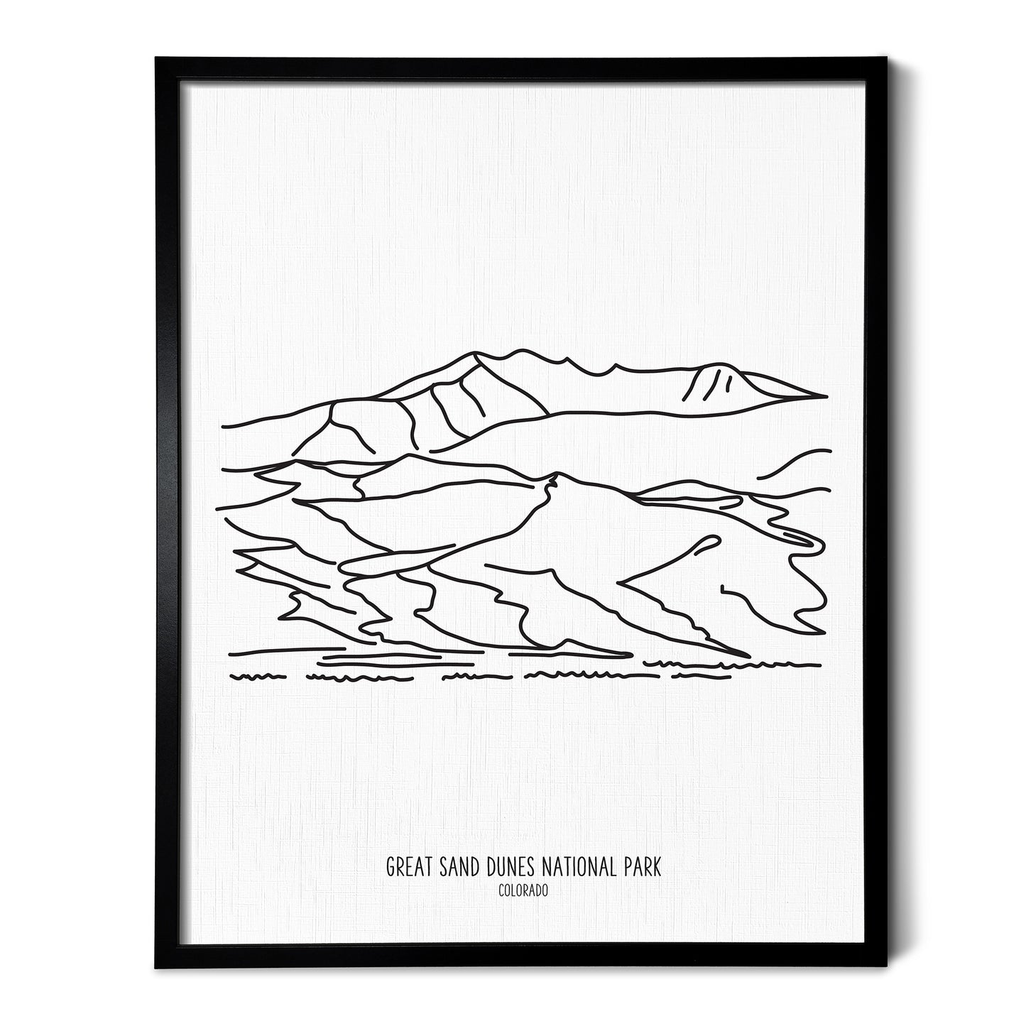 A line art drawing of Great Sand Dunes National Park on white linen paper in a thin black picture frame