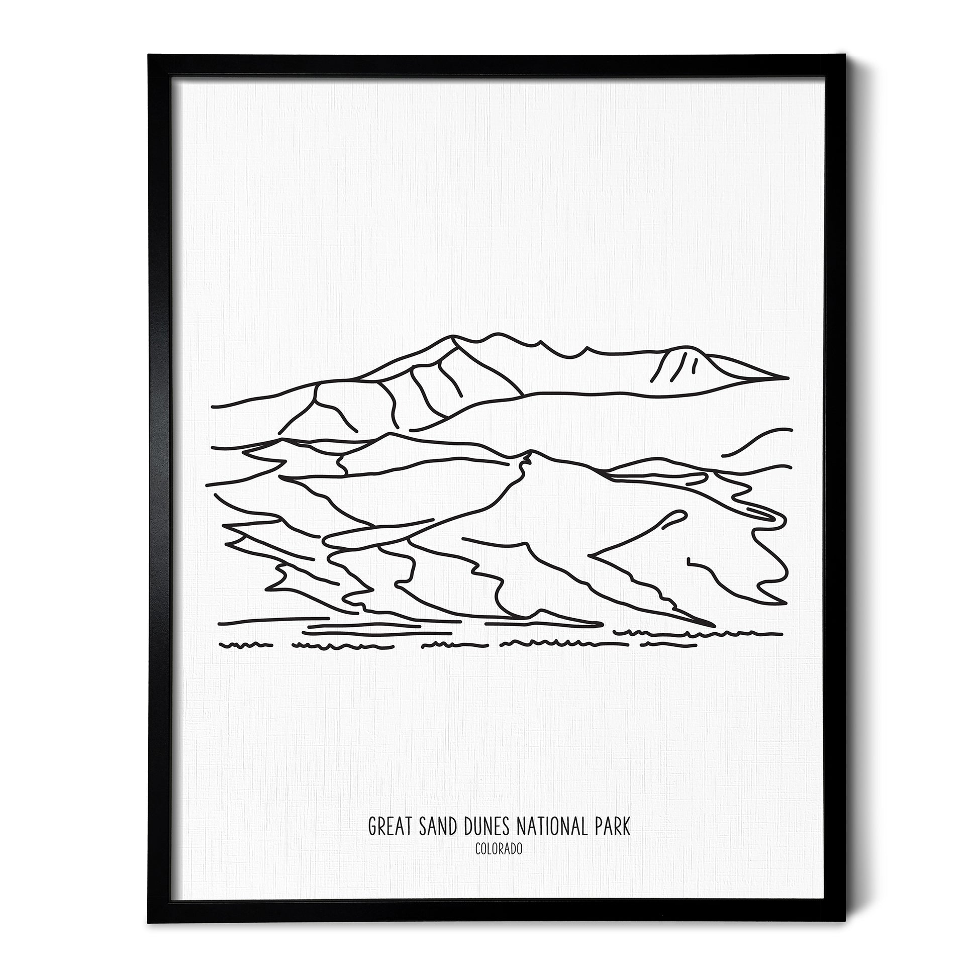 A line art drawing of Great Sand Dunes National Park on white linen paper in a thin black picture frame