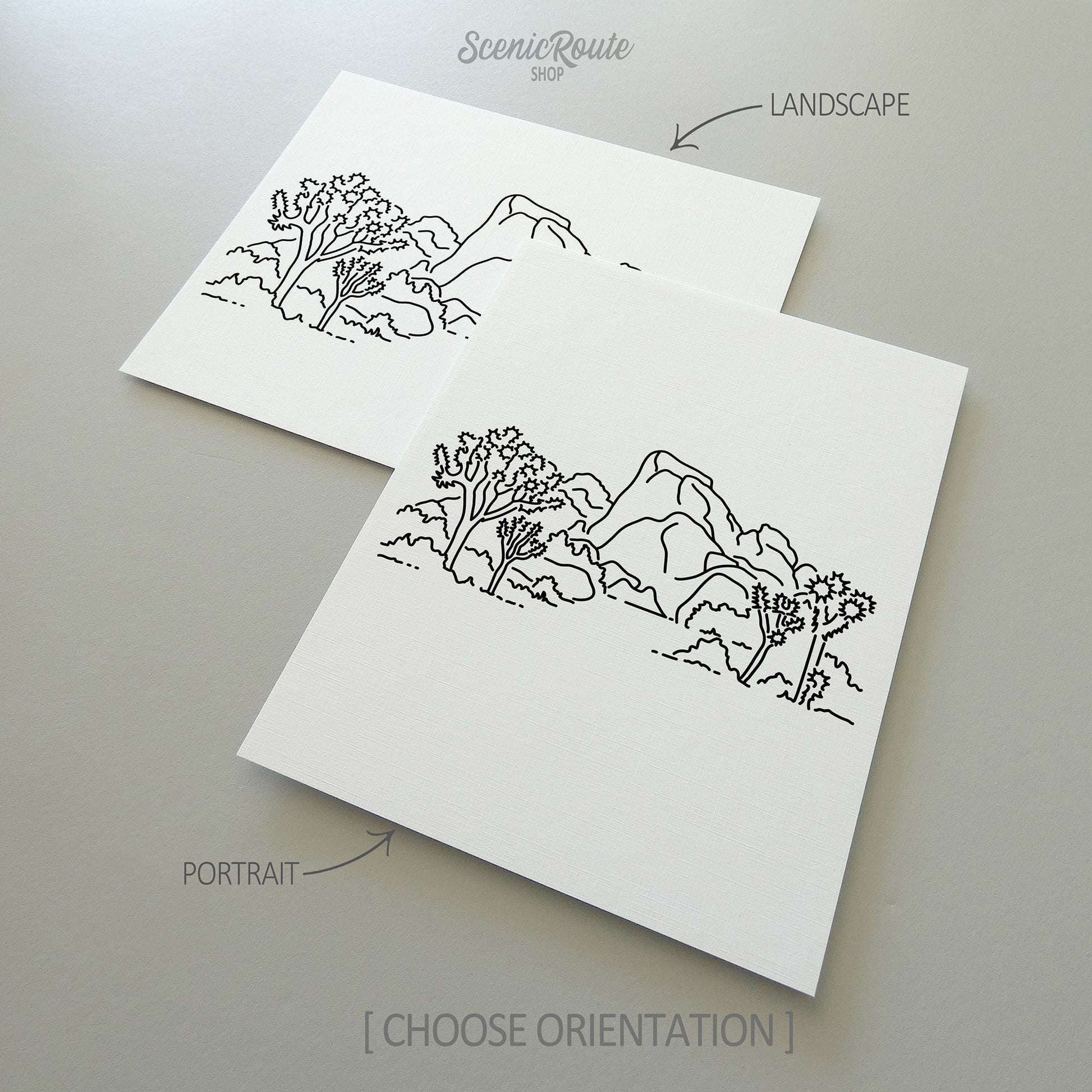 Two line art drawings of Joshua Tree National Park on white linen paper with a gray background.  The pieces are shown in portrait and landscape orientation for the available art print options.