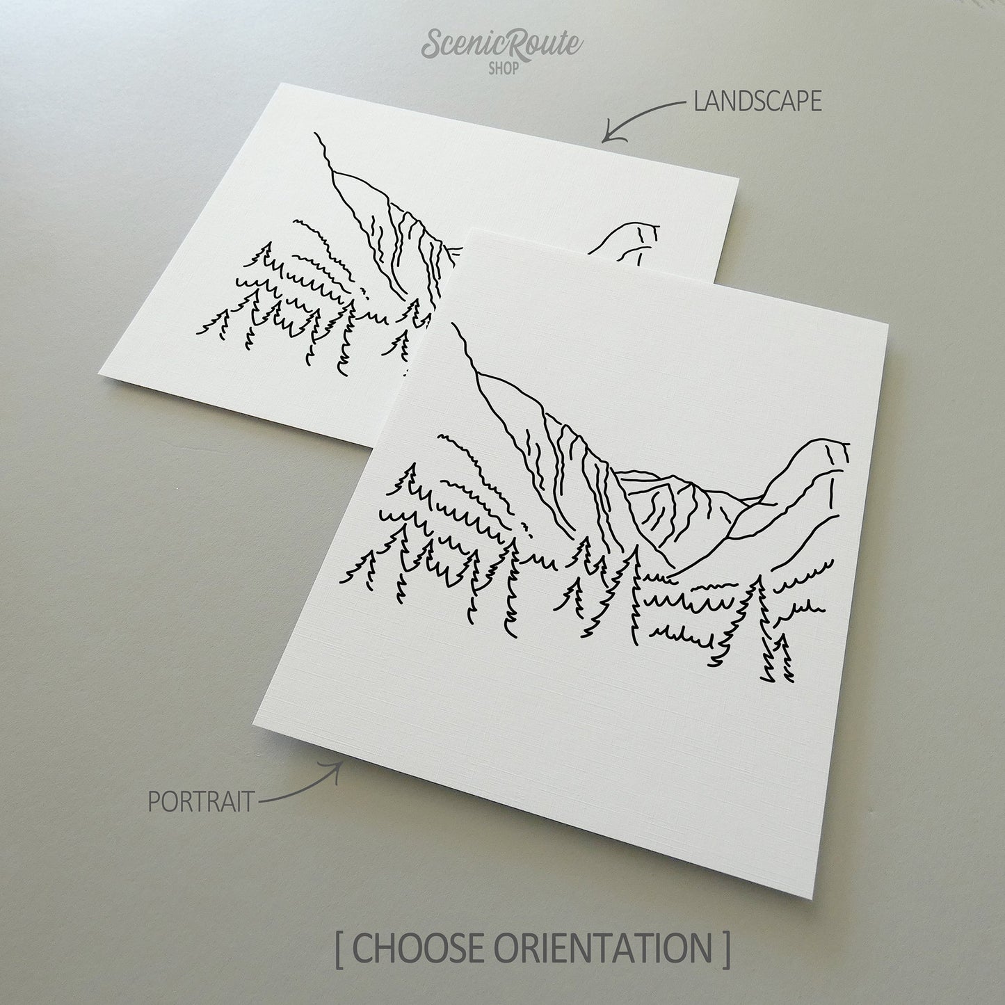 Two line art drawings of Kings Canyon National Park on white linen paper with a gray background.  The pieces are shown in portrait and landscape orientation for the available art print options.