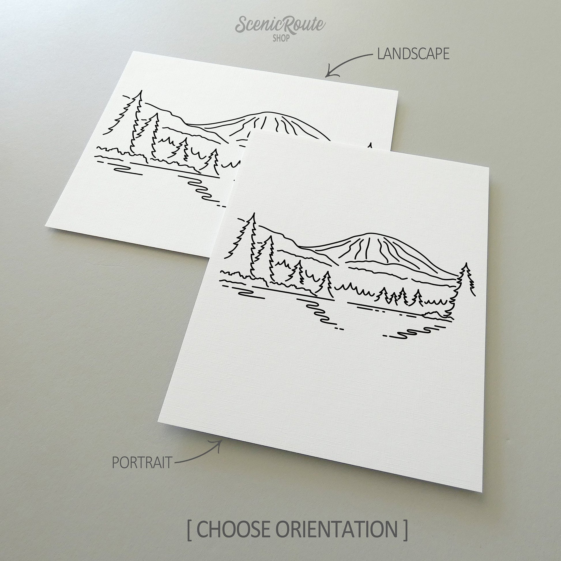 Two line art drawings of Lassen Volcanic National Park on white linen paper with a gray background.  The pieces are shown in portrait and landscape orientation for the available art print options.