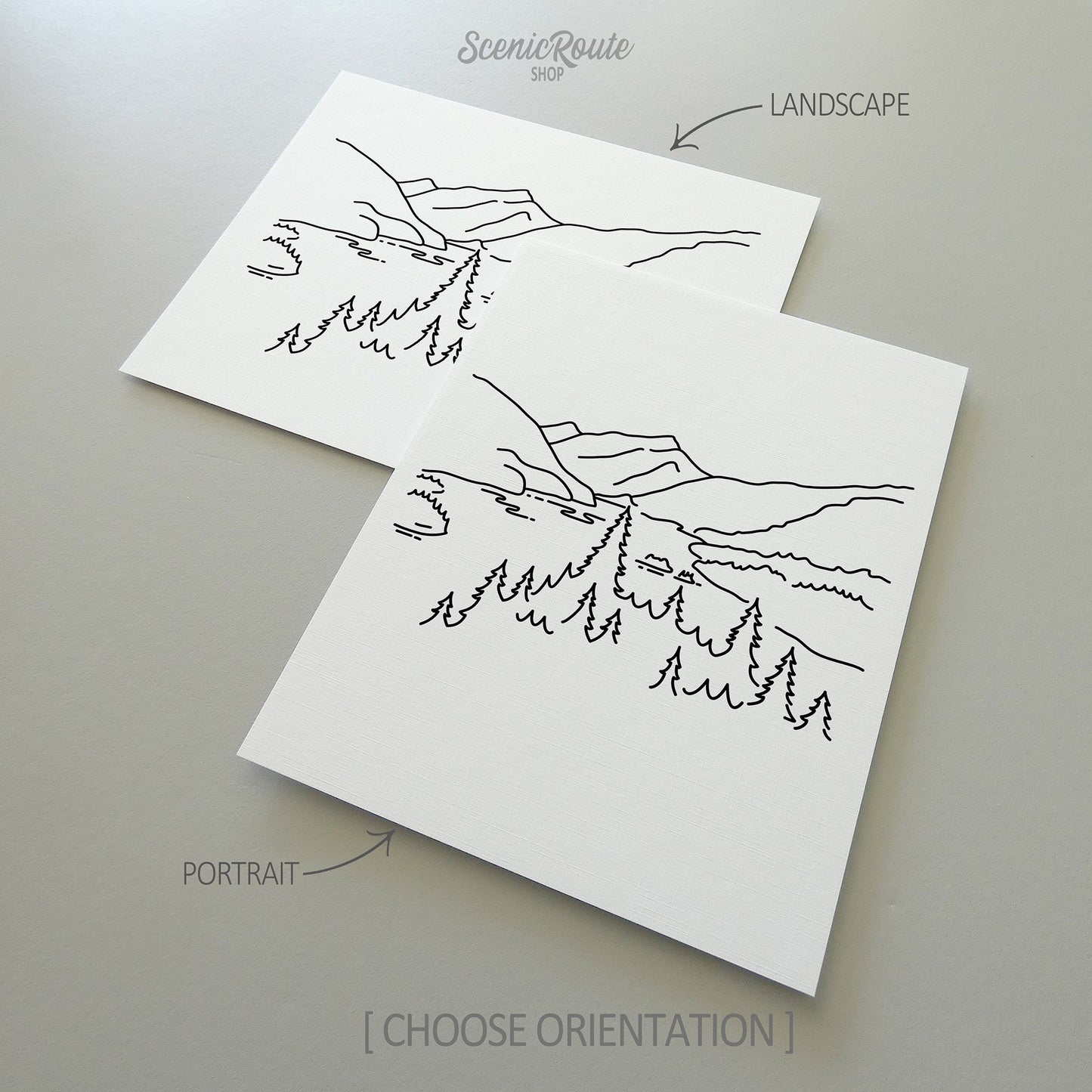 Two line art drawings of North Cascades National Park on white linen paper with a gray background.  The pieces are shown in portrait and landscape orientation for the available art print options.