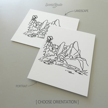 Two line art drawings of Pinnacles National Park on white linen paper with a gray background.  The pieces are shown in portrait and landscape orientation for the available art print options.