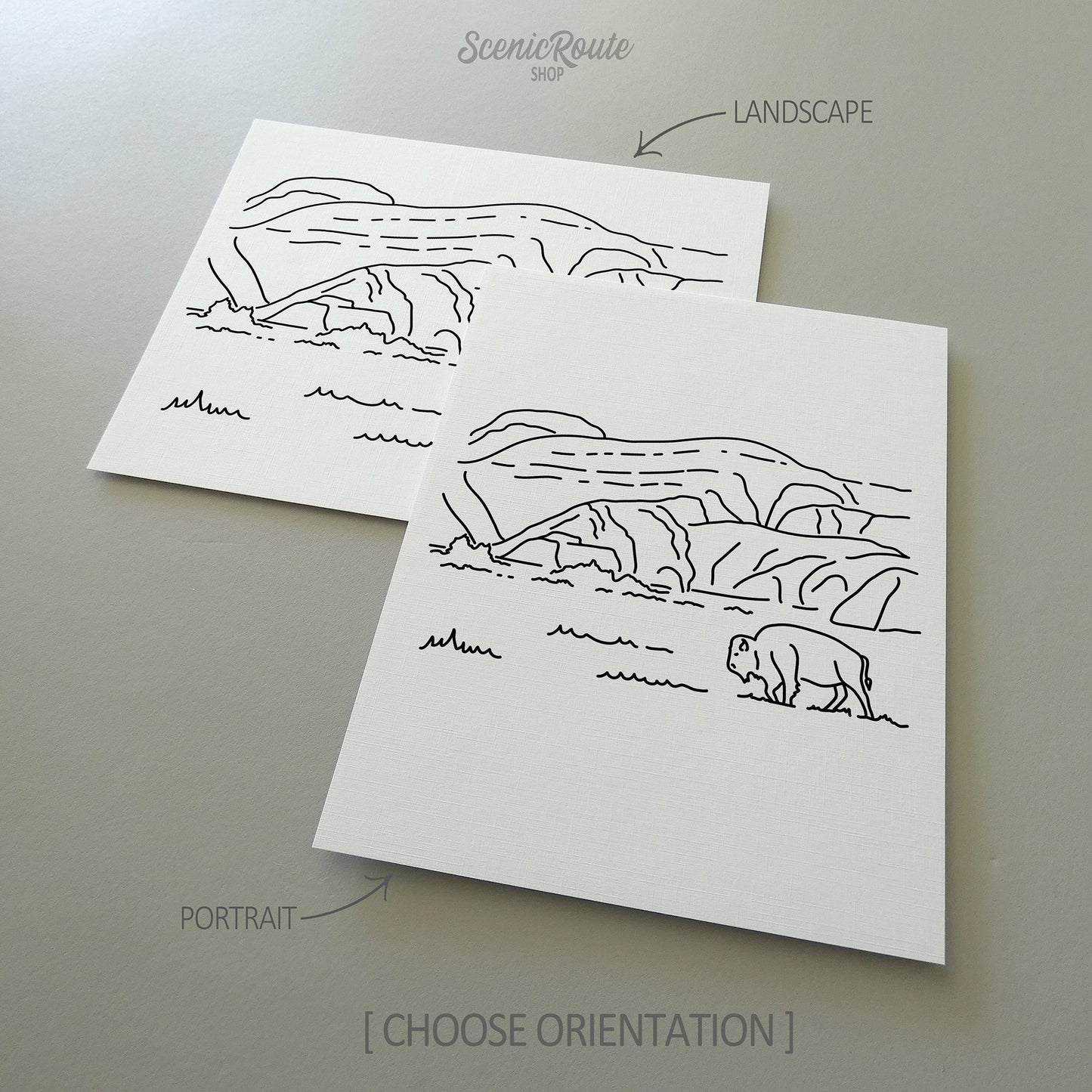 Two line art drawings of Theodore Roosevelt National Park on white linen paper with a gray background.  The pieces are shown in portrait and landscape orientation for the available art print options.