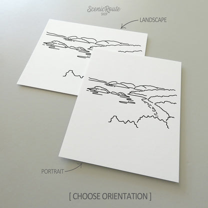 Two line art drawings of Virgin Islands National Park on white linen paper with a gray background.  The pieces are shown in portrait and landscape orientation for the available art print options.