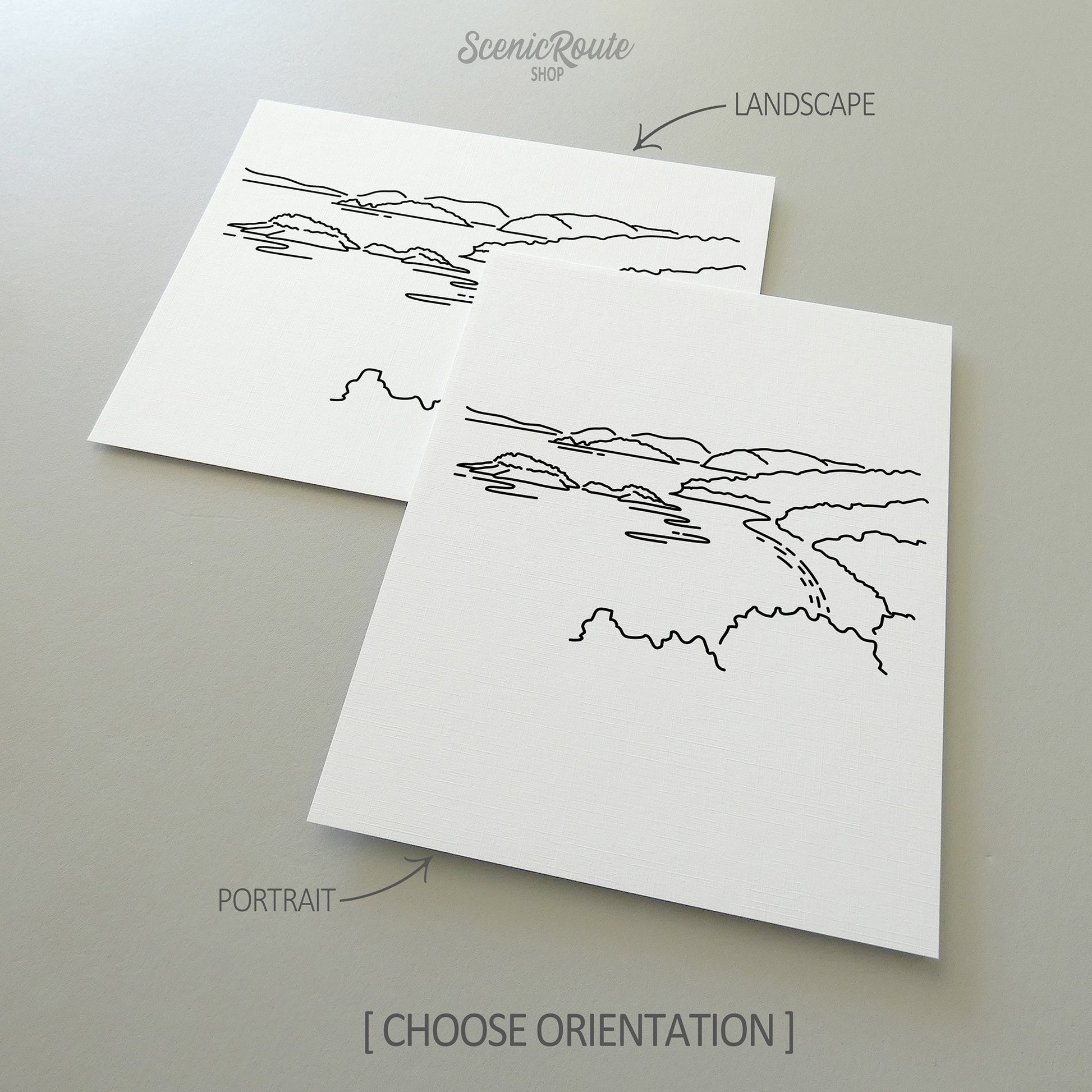 Two line art drawings of Virgin Islands National Park on white linen paper with a gray background.  The pieces are shown in portrait and landscape orientation for the available art print options.