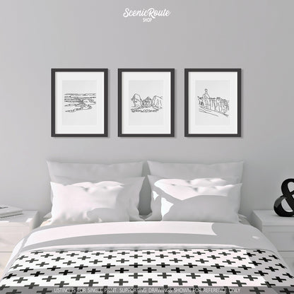A group of three framed drawings on a wall above a bed. The line art drawings include Canyonlands National Park, Zion National Park, and Bryce Canyon National Park