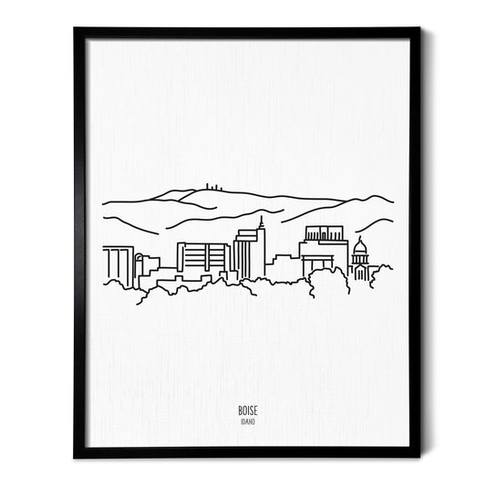 A line art drawing of the Boise Idaho Skyline on white linen paper in a thin black picture frame