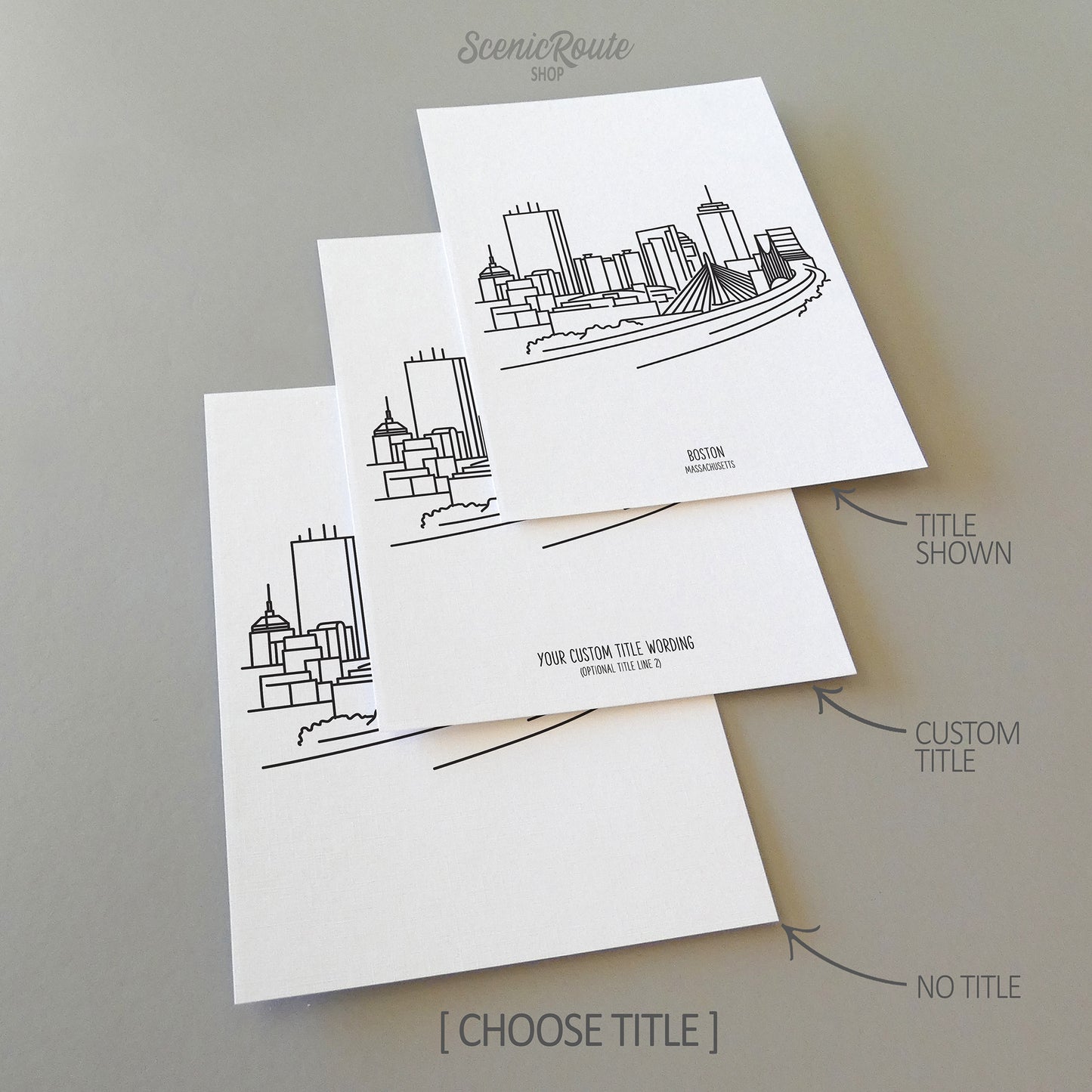 Three line art drawings of the Boston Massachusetts Skyline on white linen paper with a gray background. The pieces are shown with title options that can be chosen and personalized.