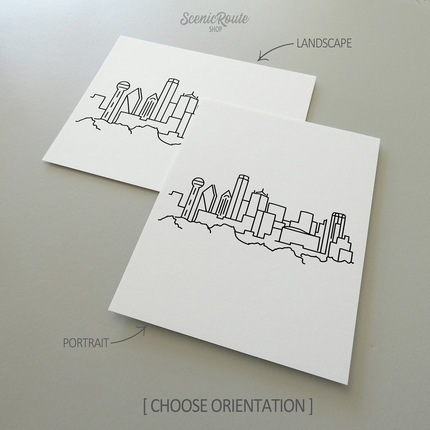 Two line art drawings of the Dallas Skyline on white linen paper with a gray background.  The pieces are shown in portrait and landscape orientation for the available art print options.