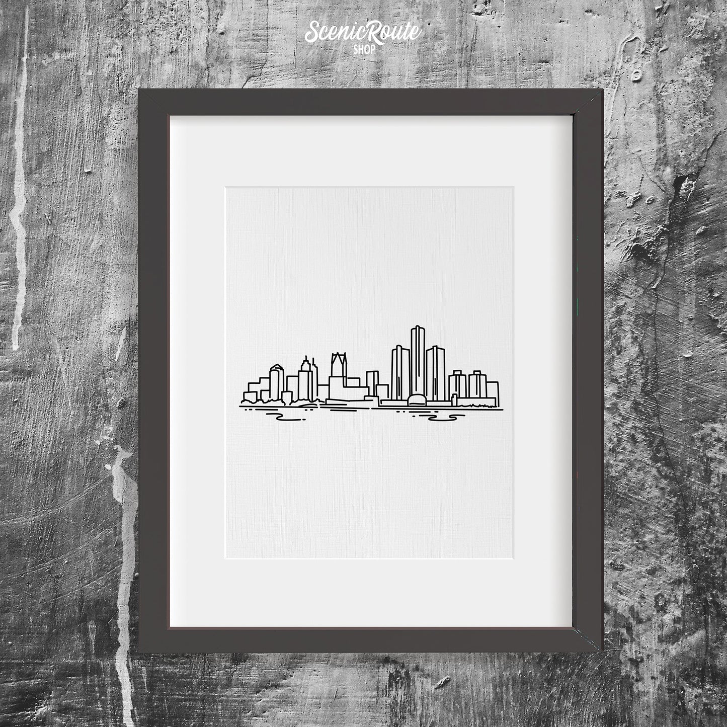 A framed line art drawing of the Detroit Skyline