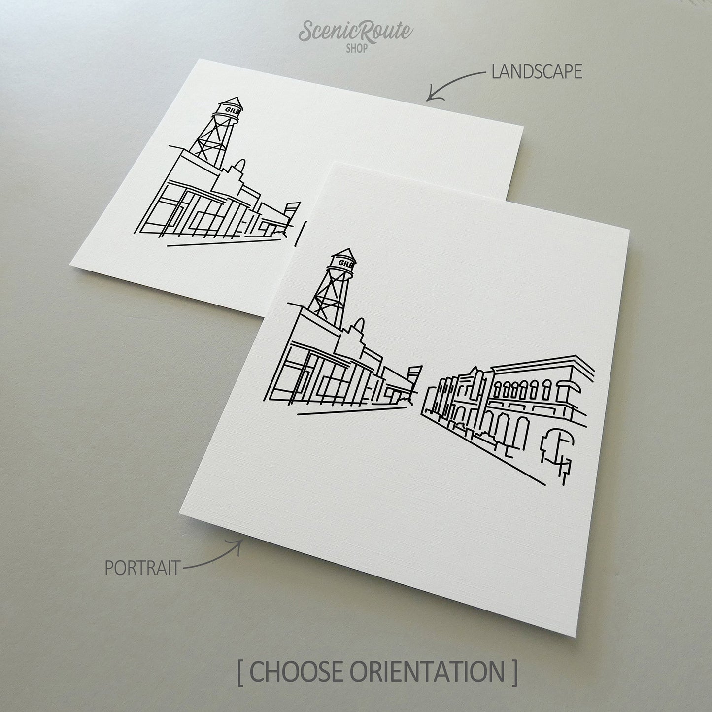 Two line art drawings of the Gilbert Skyline on white linen paper with a gray background.  The pieces are shown in portrait and landscape orientation for the available art print options.