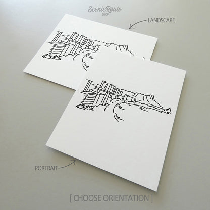 Two line art drawings of the Honolulu Skyline on white linen paper with a gray background.  The pieces are shown in portrait and landscape orientation for the available art print options.