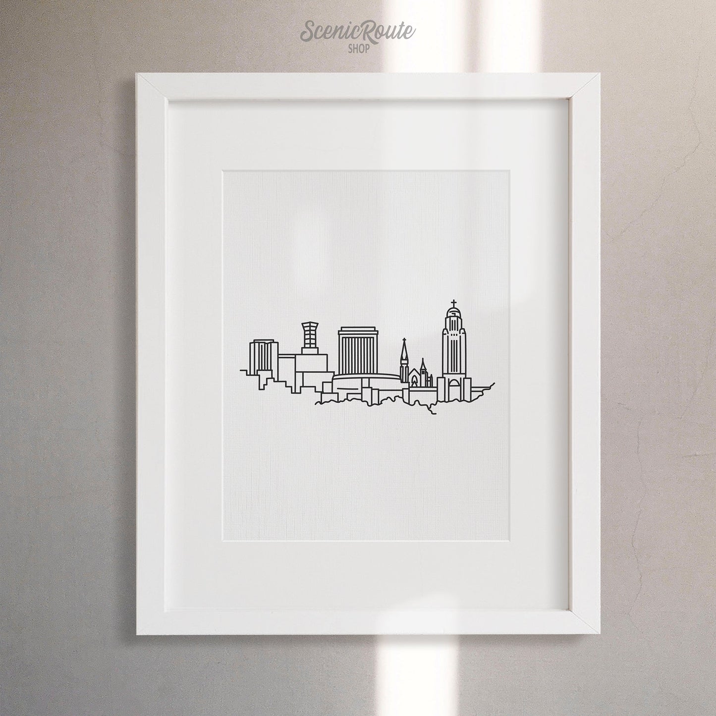 A framed line art drawing of the Lincoln Skyline