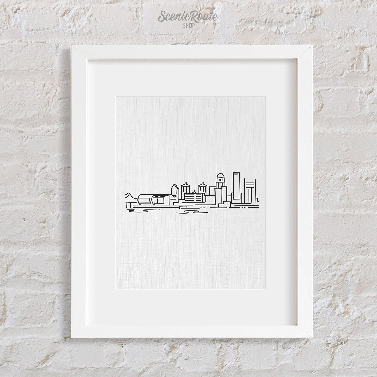 A framed line art drawing of the Louisville Skyline