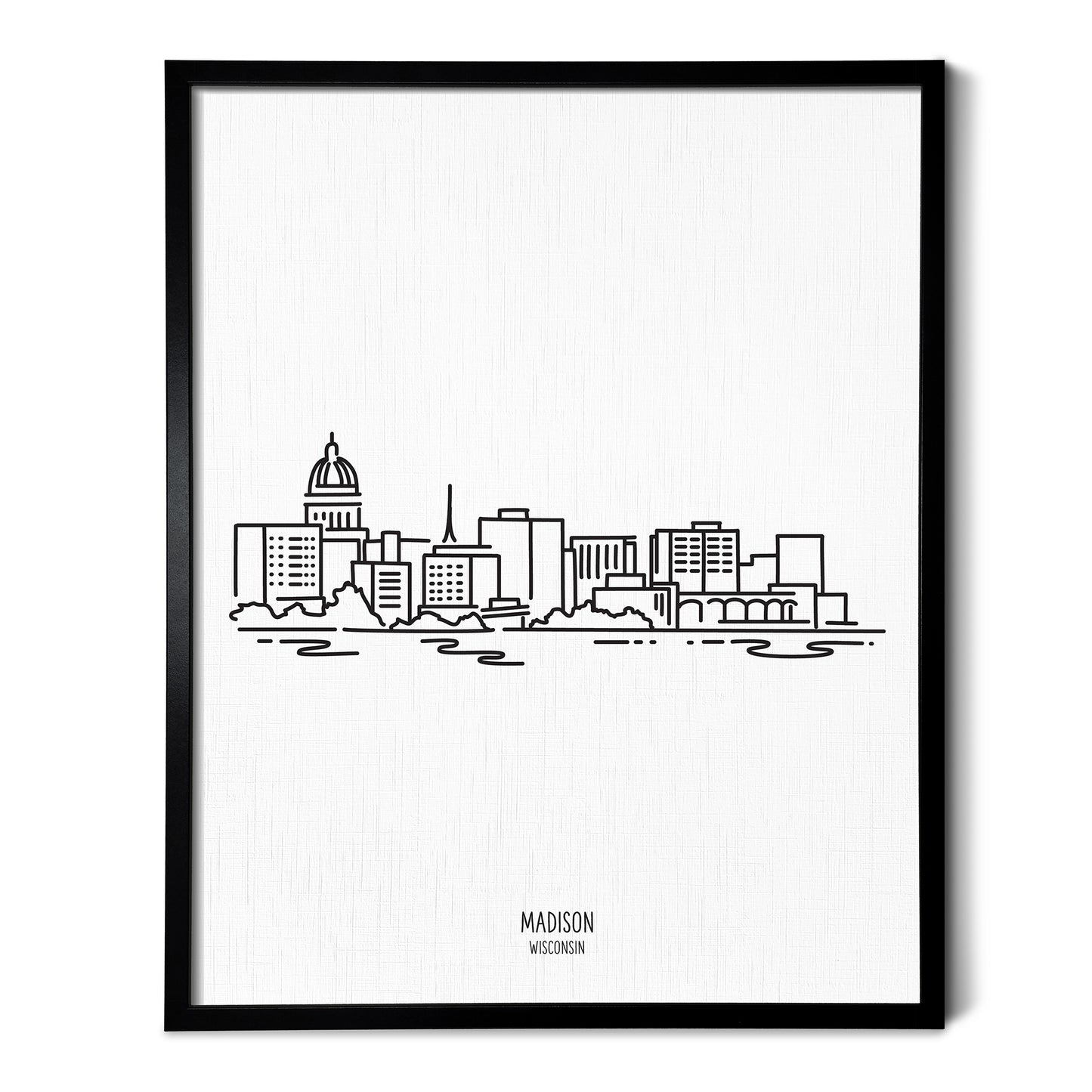 A line art drawing of the Madison Wisconsin Skyline on white linen paper in a thin black picture frame