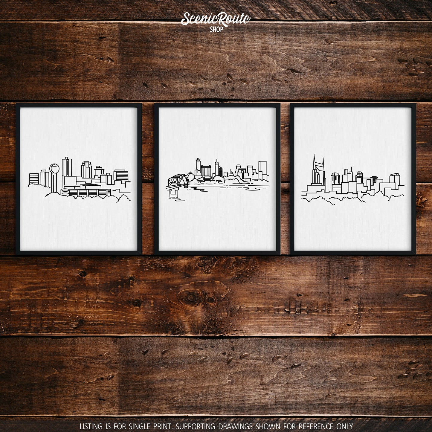 A group of three framed drawings on a wood wall. The line art drawings include the Knoxville Skyline, Memphis Skyline, and Nashville Skyline