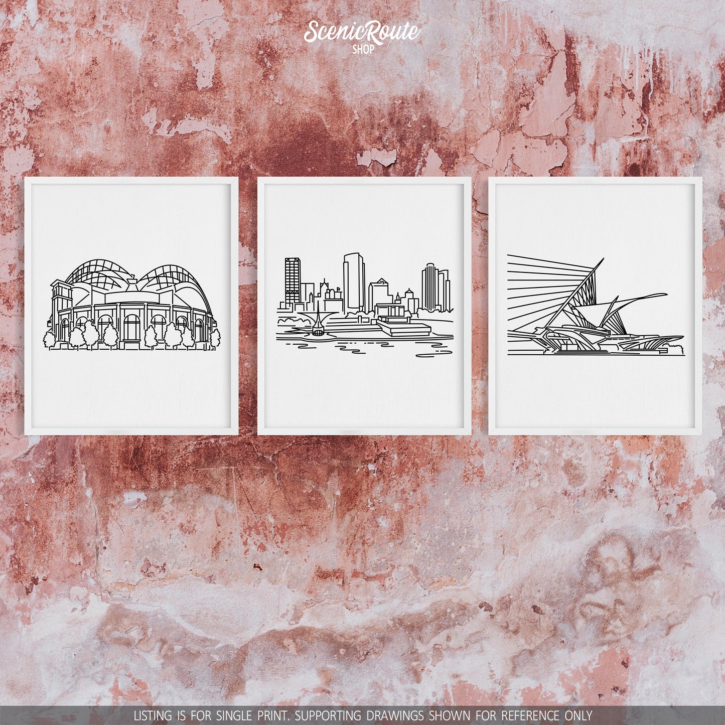 A group of three framed drawings on a concrete wall. The line art drawings include the Milwaukee Brewers Ballpark, Milwaukee Skyline, and Milwaukee Art Museum