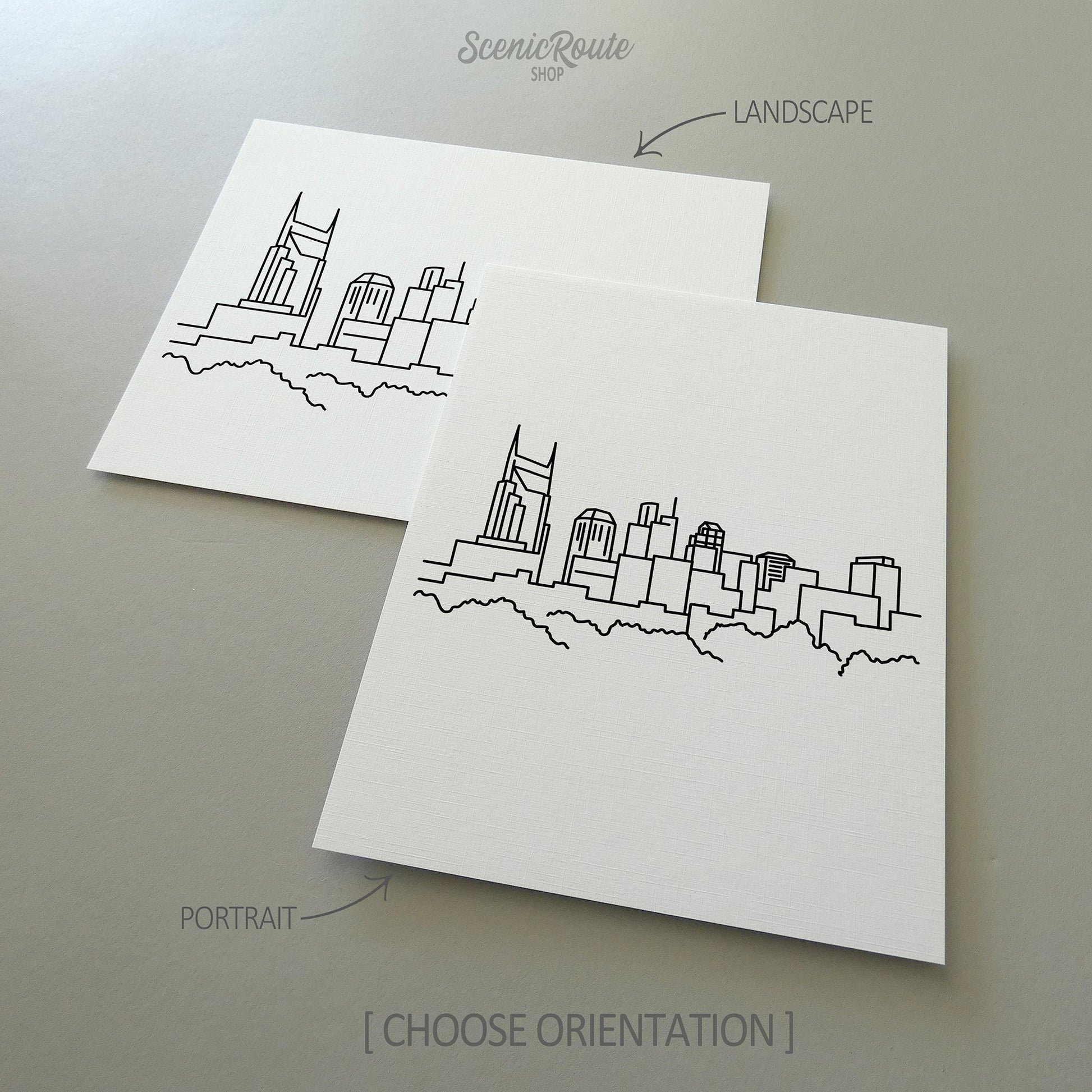 Two line art drawings of the Nashville Skyline on white linen paper with a gray background.  The pieces are shown in portrait and landscape orientation for the available art print options.