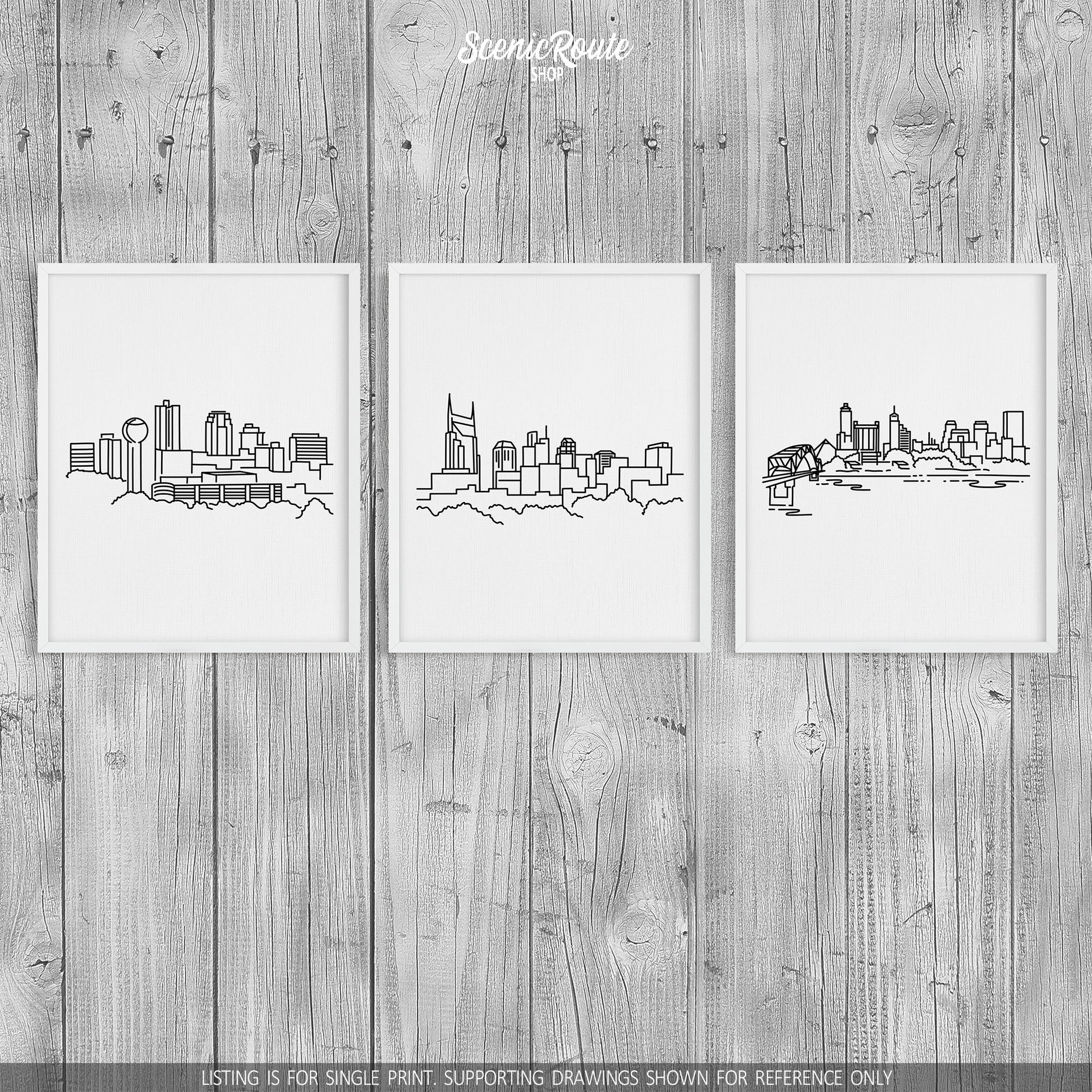 A group of three framed drawings on a wood wall. The line art drawings include the Knoxville Skyline, Nashville Skyline, and Memphis Skyline