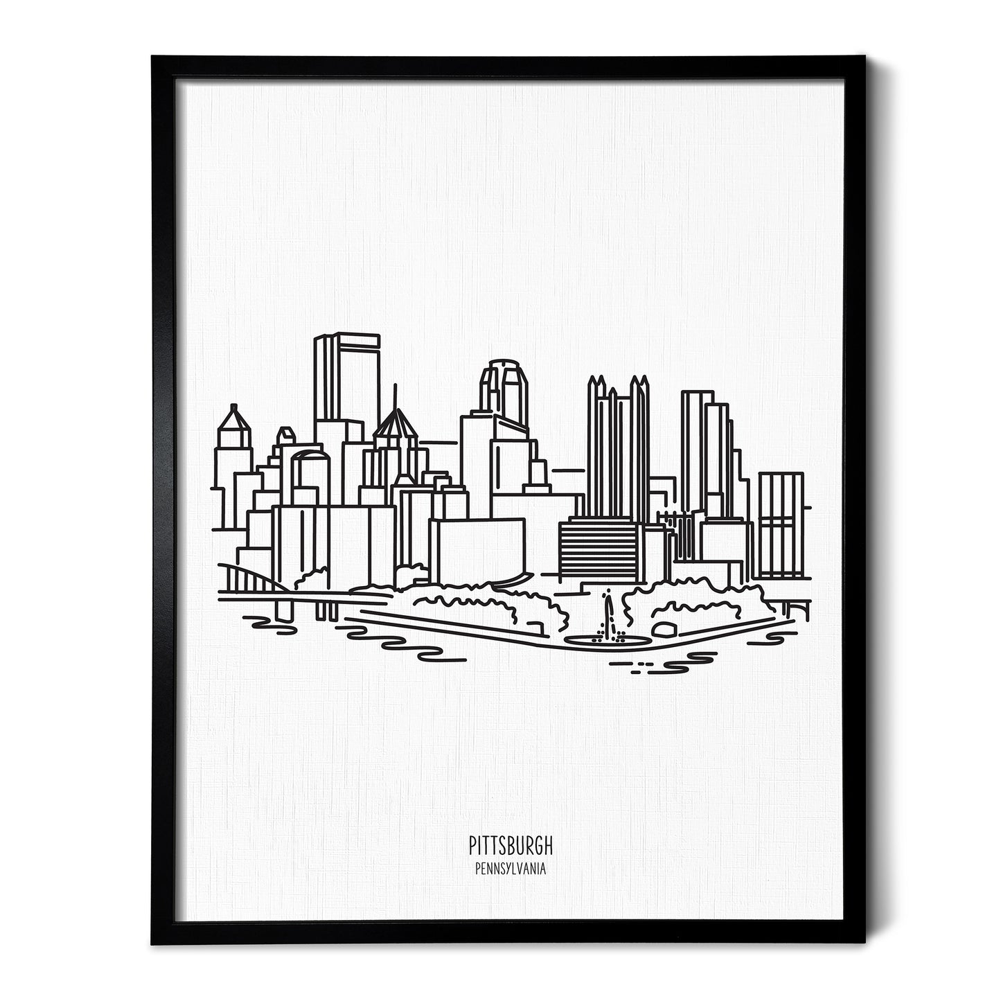 A line art drawing of the Pittsburgh Pennsylvania Skyline on white linen paper in a thin black picture frame