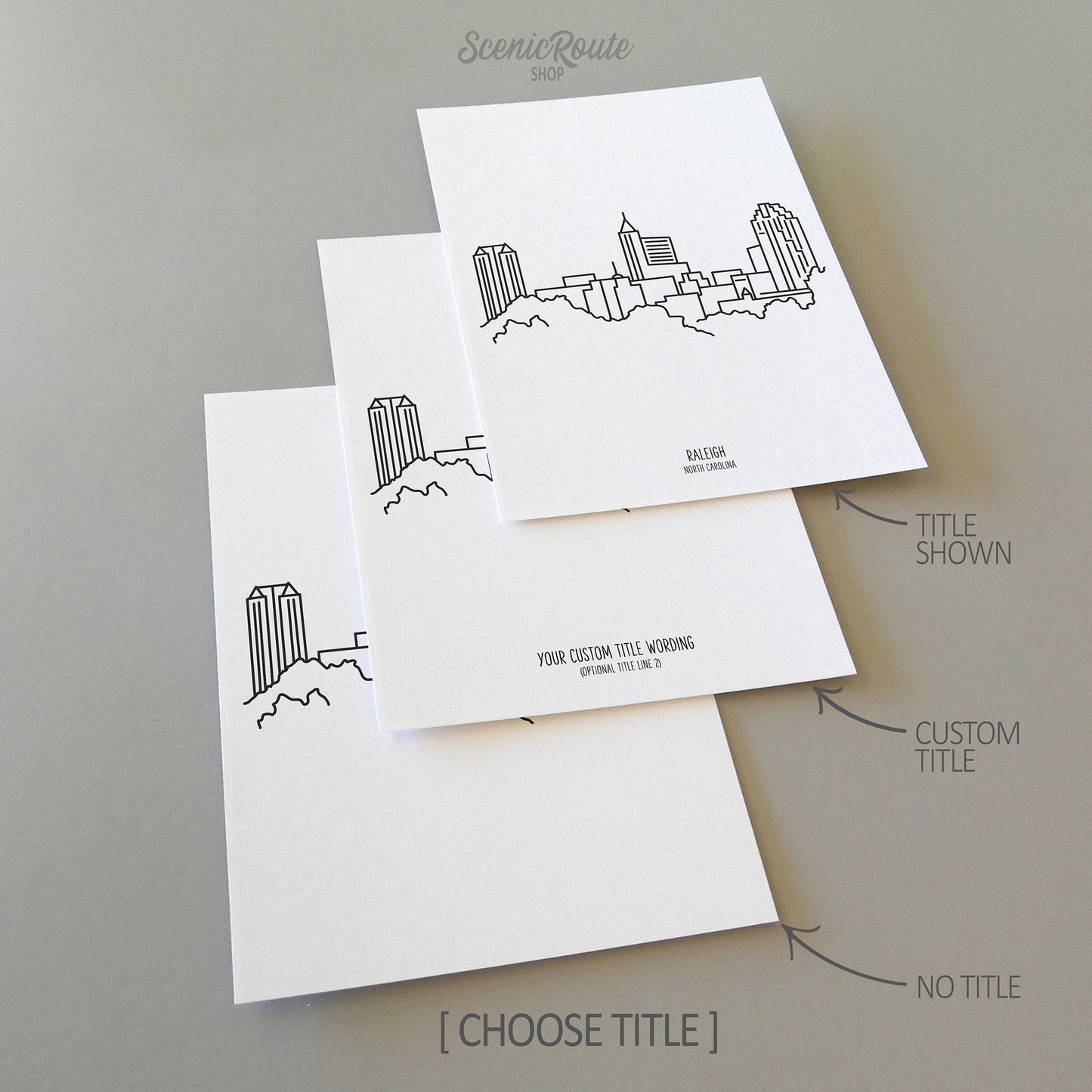 Three line art drawings of the Raleigh North Carolina Skyline on white linen paper with a gray background. The pieces are shown with title options that can be chosen and personalized.