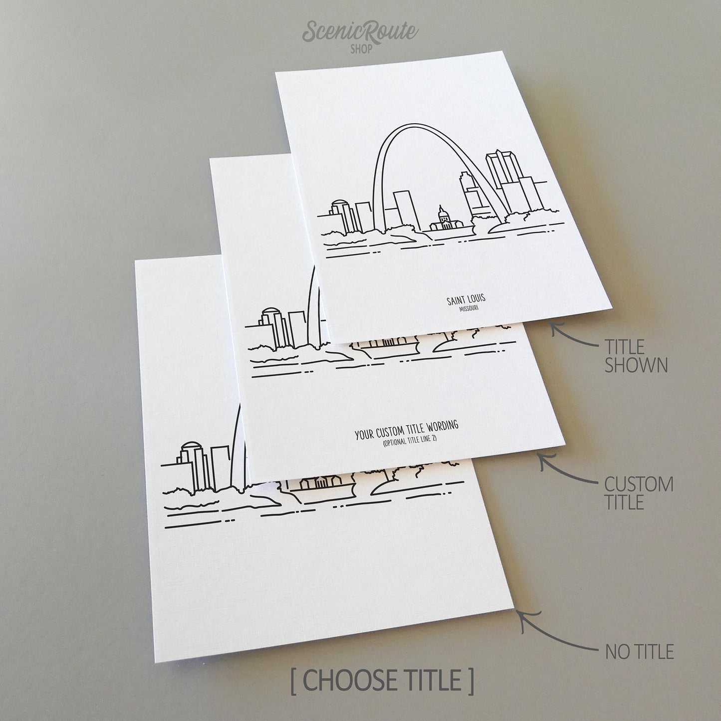 Three line art drawings of the Saint Louis Missouri Skyline on white linen paper with a gray background. The pieces are shown with title options that can be chosen and personalized.