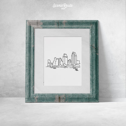 A framed line art drawing of the San Diego Skyline